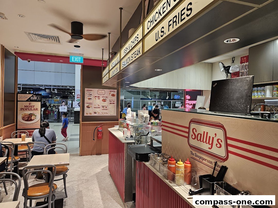 Interior view of Sally's, a Singaporean food stall with seating and a counter.