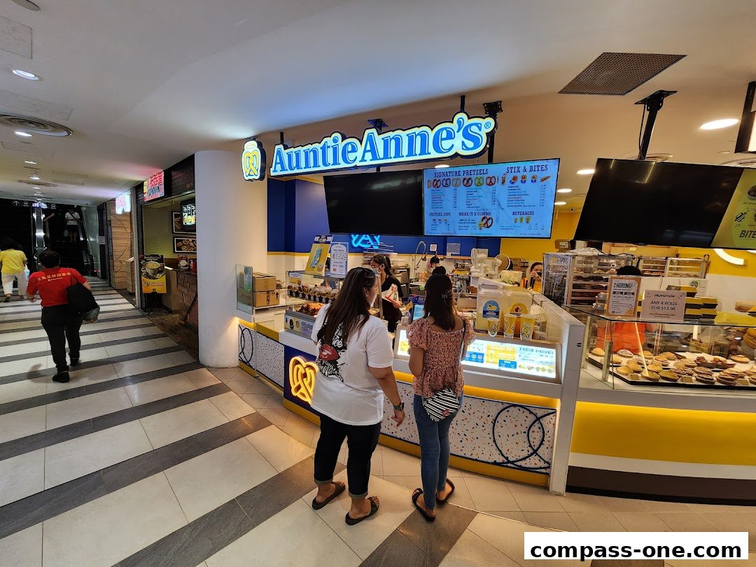 Auntie Anne's pretzel shop with customers ordering at the counter.