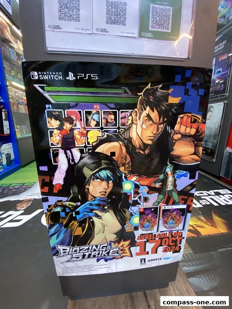 A promotional stand for the game Blazing Strike, featuring characters and release information.
