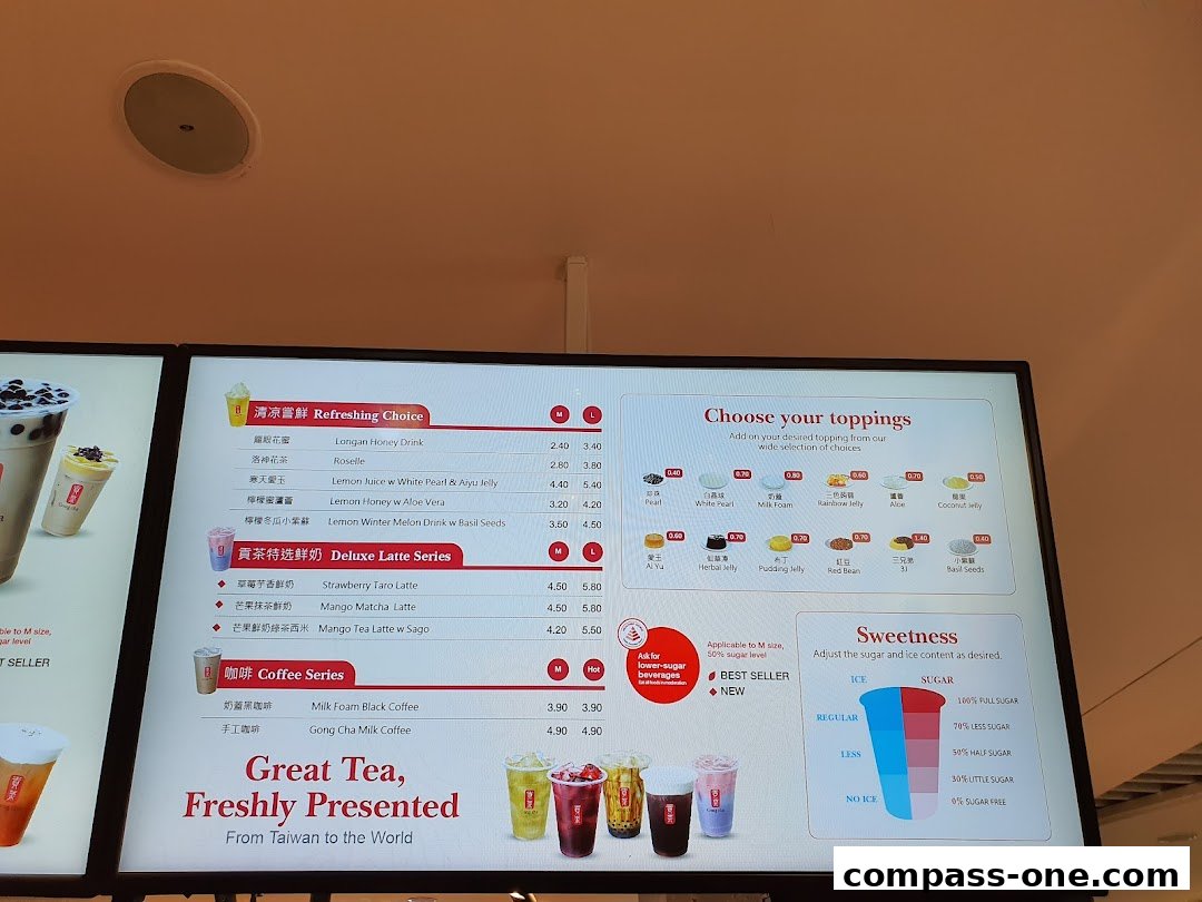 A digital menu board displaying various bubble tea drinks, toppings, and sweetness options.