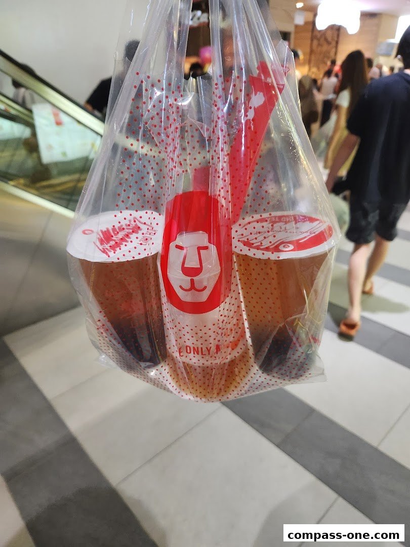 A plastic bag filled with LiHO TEA drinks, featuring the brand's logo.