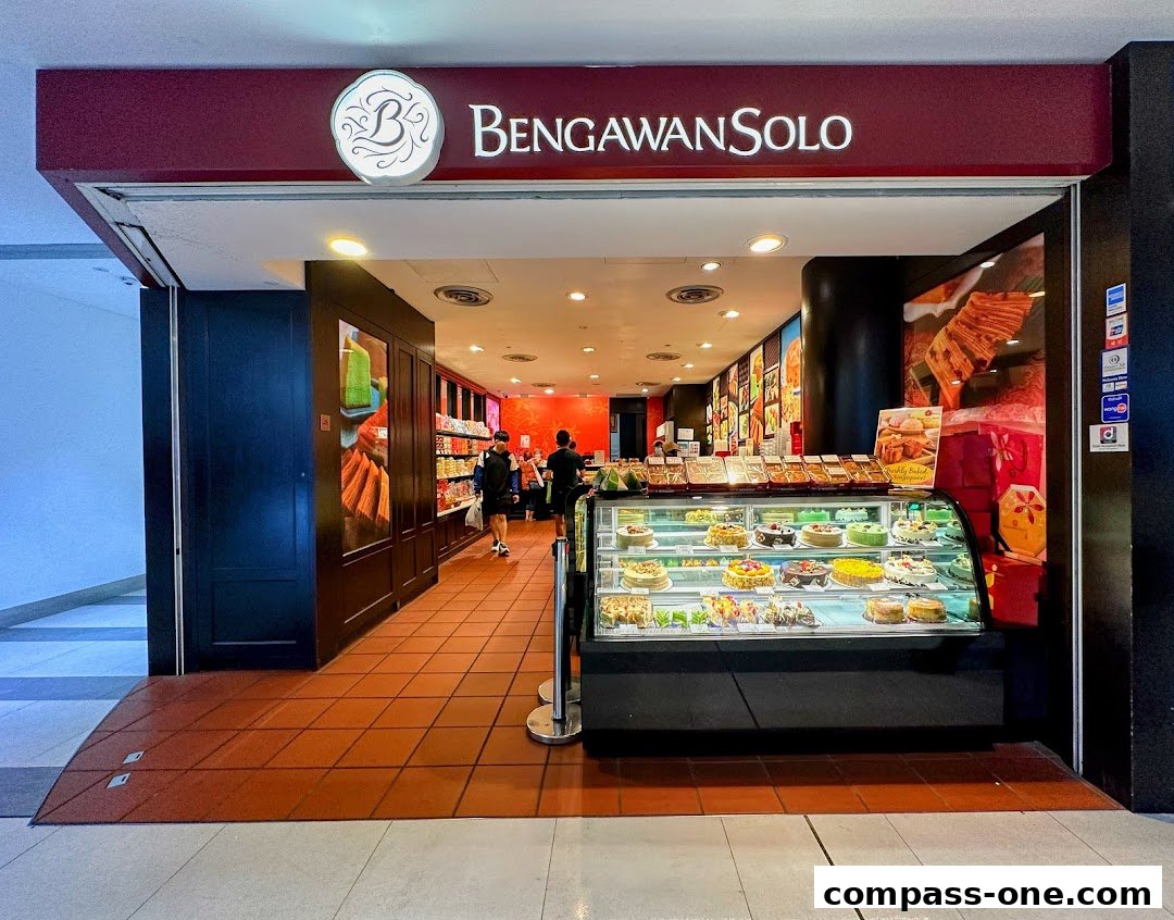 The entrance of Bengawan Solo, a shop displaying a variety of cakes and pastries in a refrigerated display case.