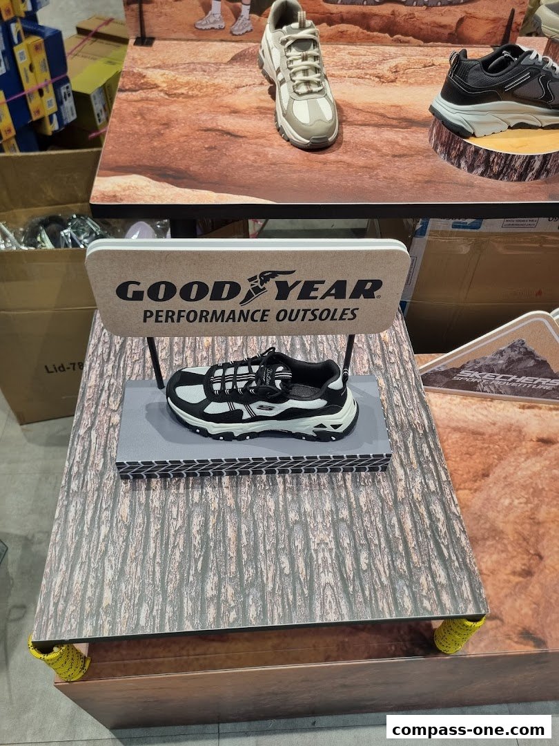 A display of Skechers shoes featuring Goodyear performance outsoles on a textured surface.