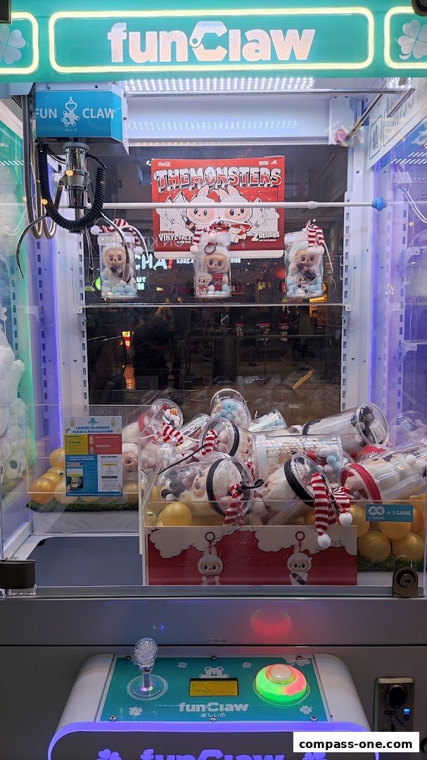A Fun Claw arcade machine filled with plush toys and prizes.