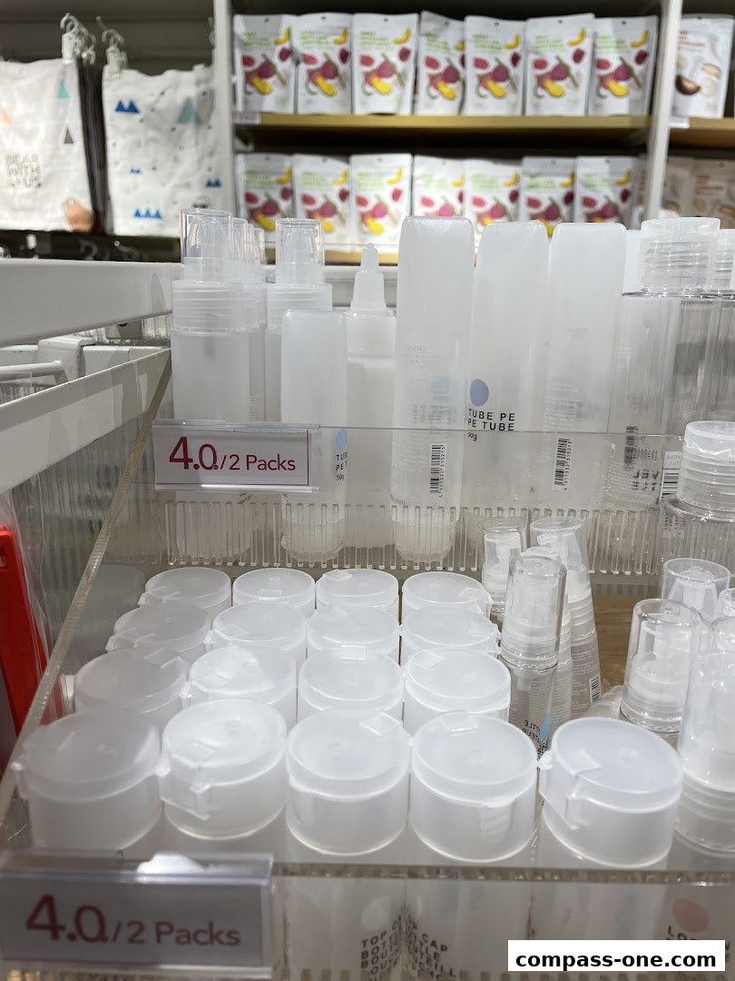 Assortment of clear plastic travel-sized bottles and containers on display.