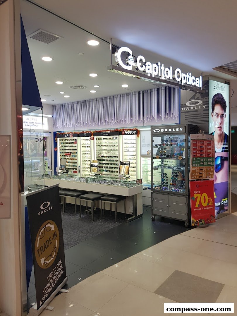 Capitol Optical shop front displaying various eyewear brands and a trade-in promotion.