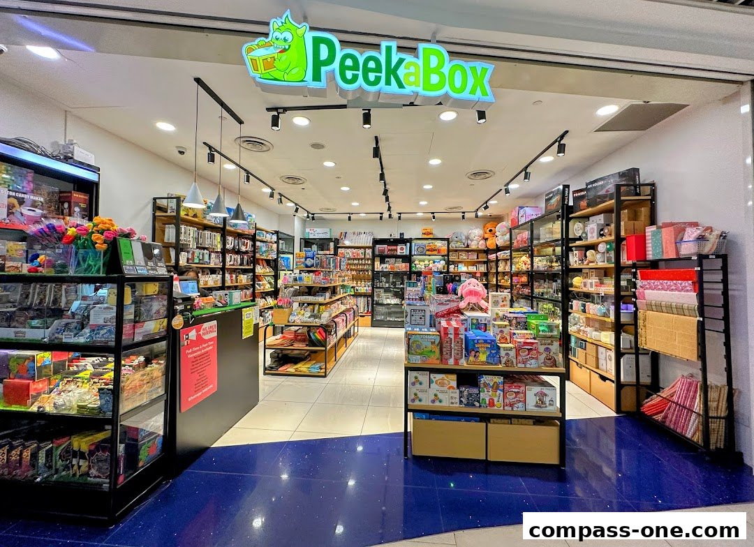 Interior view of Peek A Box toy and gift shop, showcasing shelves filled with various products.