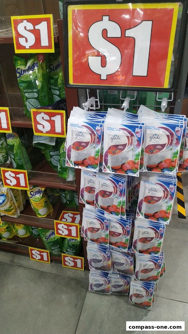 A display of household cleaning products and air fresheners, all priced at $1.