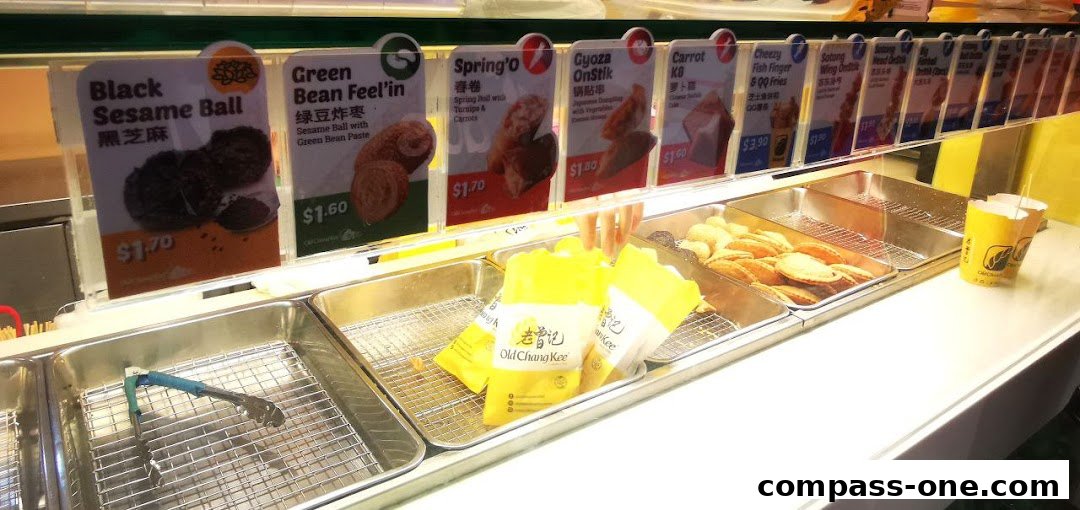 A display of various fried snacks with their names and prices at Old Chang Kee.