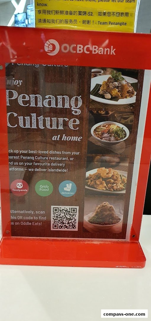A sign for Penang Culture restaurant promoting delivery services and a QR code.
