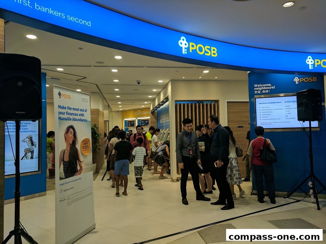 POSB bank branch interior with customers and promotional banners.