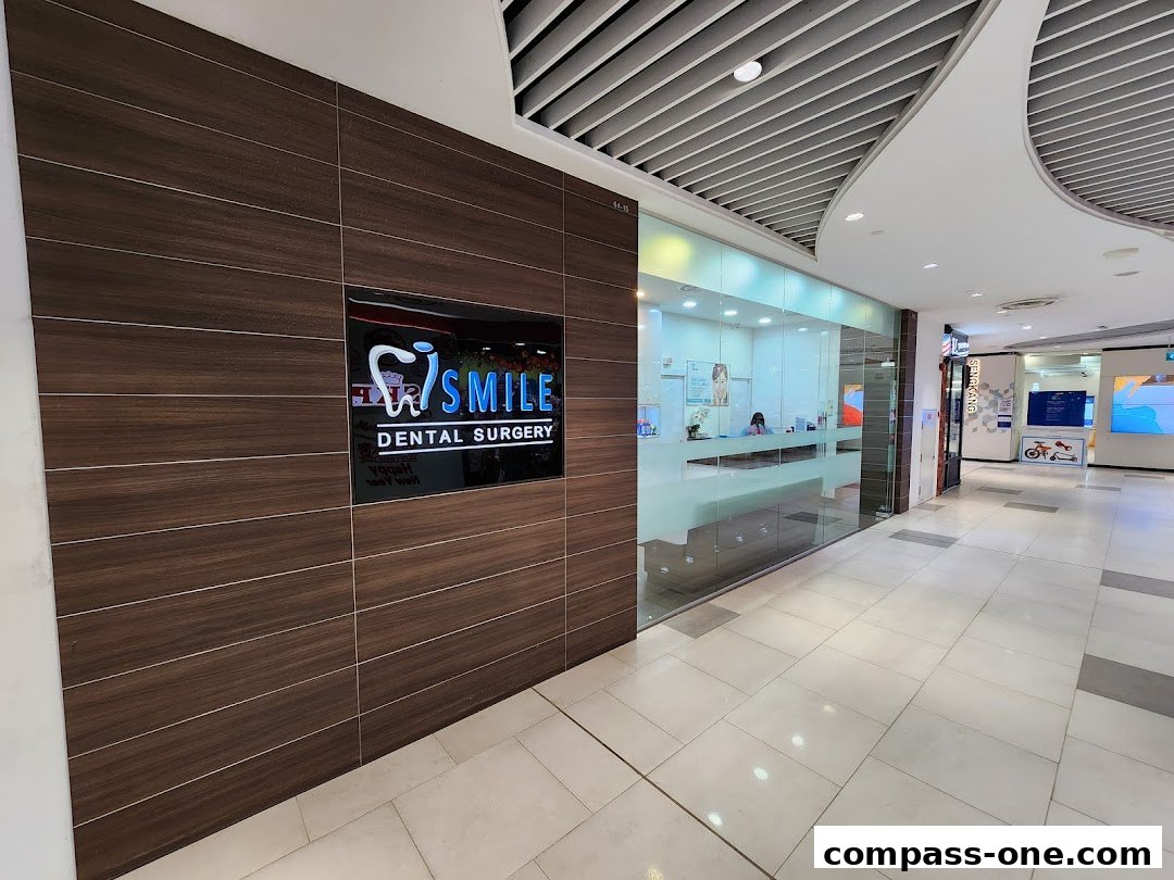 The exterior of iSmile Dental Surgery with a prominent sign and glass-fronted reception area.