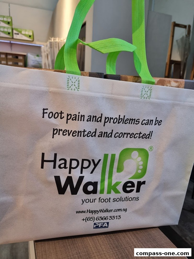 A reusable shopping bag with the Happy Walker logo and contact information.
