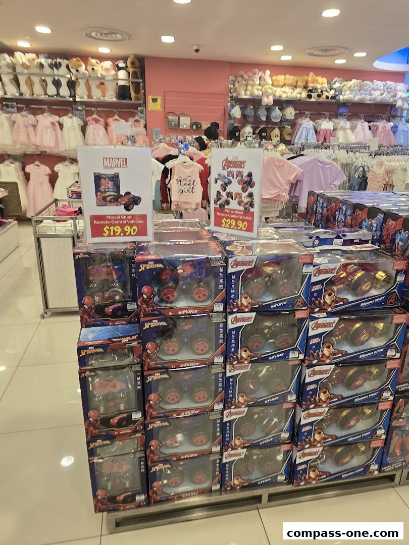 Kiddy Palace shop interior displaying Marvel stunt remote-control vehicles and children's clothing.