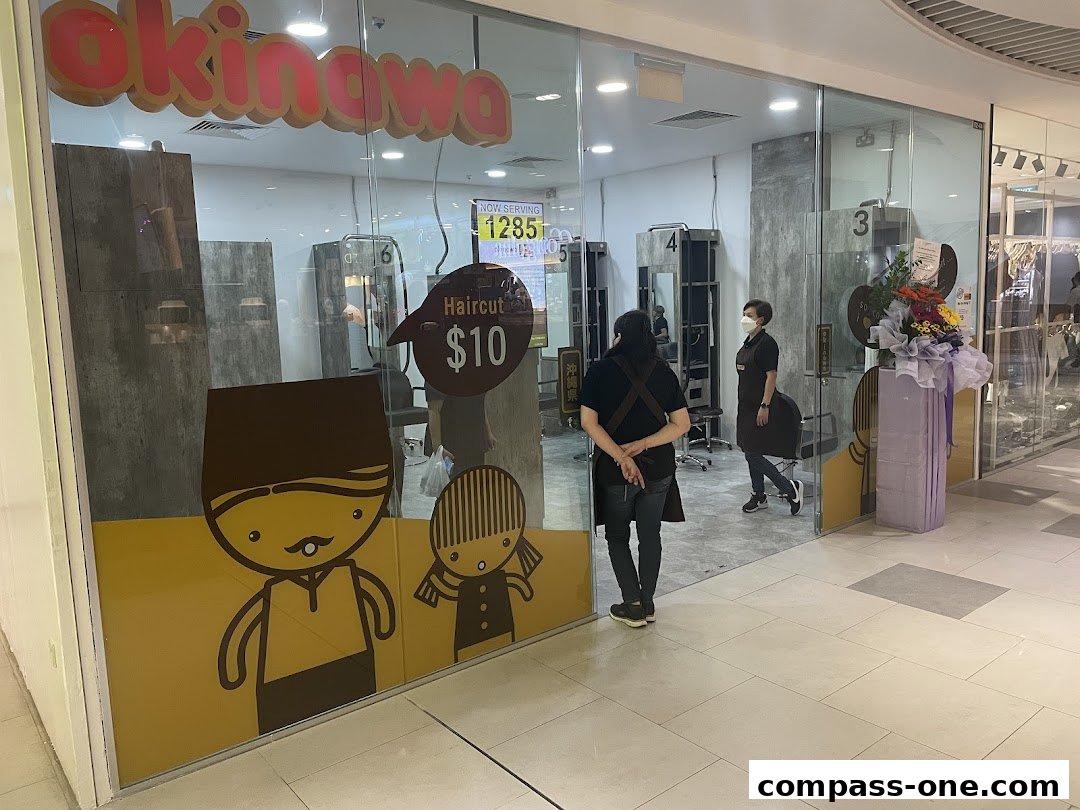 Okinawa Hair Salon storefront with cartoon characters and a haircut promotion.