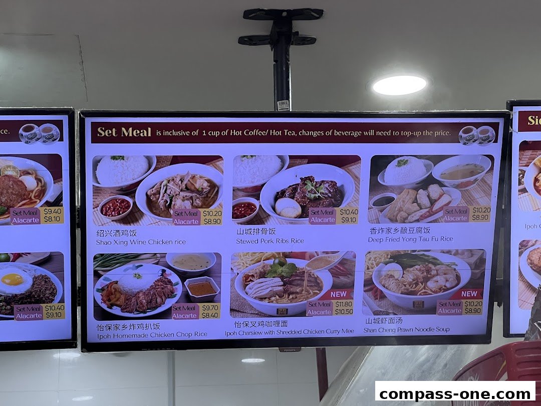 Digital menu displaying various Ipoh delicacies with prices for set meals and a la carte options.