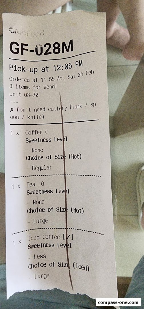 A receipt from GrabFood showing an order for coffee, tea, and iced coffee with customization options.