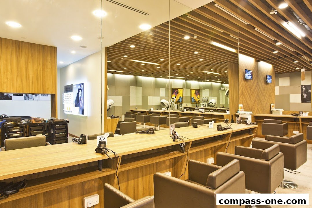 Interior view of a modern hair salon with multiple styling stations and chairs.