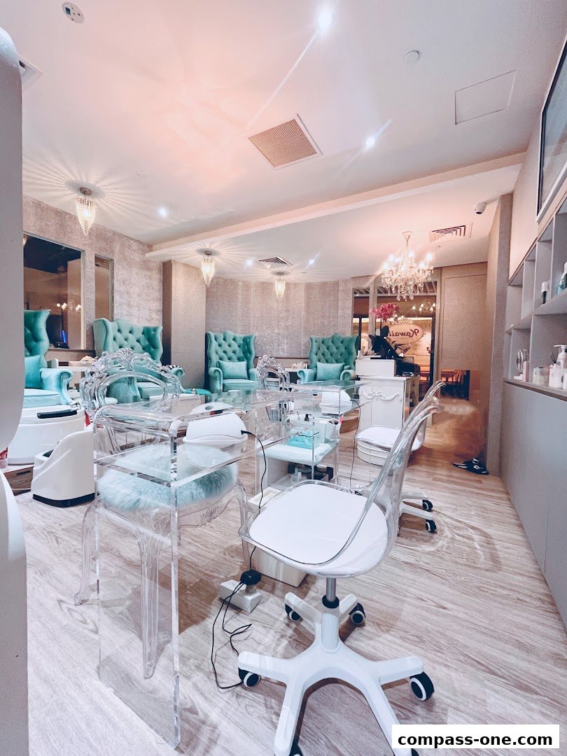 Interior of a modern nail salon with plush seating and clear manicure stations.