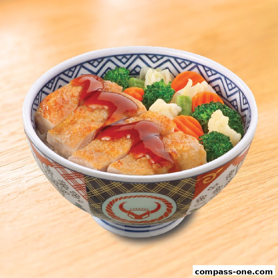 A bowl of Yoshinoya's signature dish with grilled chicken, vegetables, and sauce.