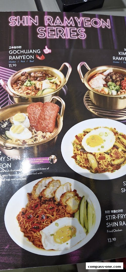 A menu showcasing various Shin Ramyon dishes with appetizing food photography.