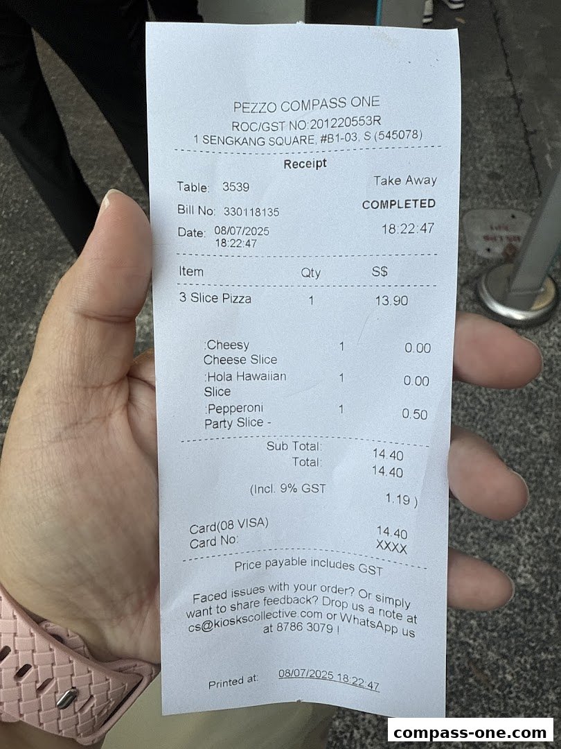 A receipt from Pezzo Compass One showing a pizza order and payment details.