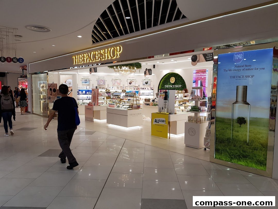 The exterior of The Face Shop, a beauty store, showcasing its products and branding.
