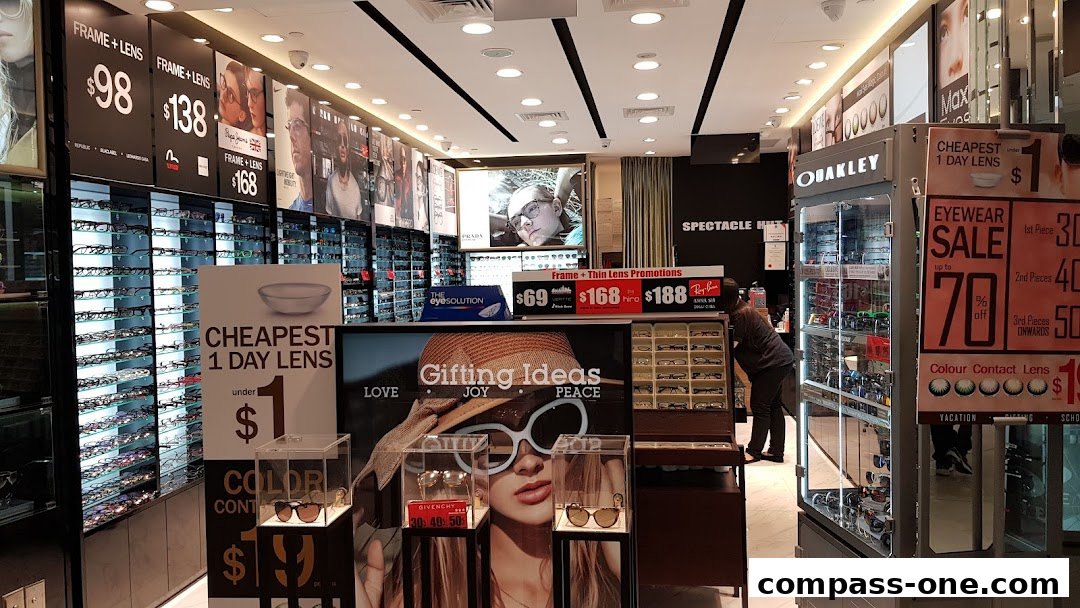 Interior view of Spectacle Hut, showcasing eyewear displays and promotional signage.