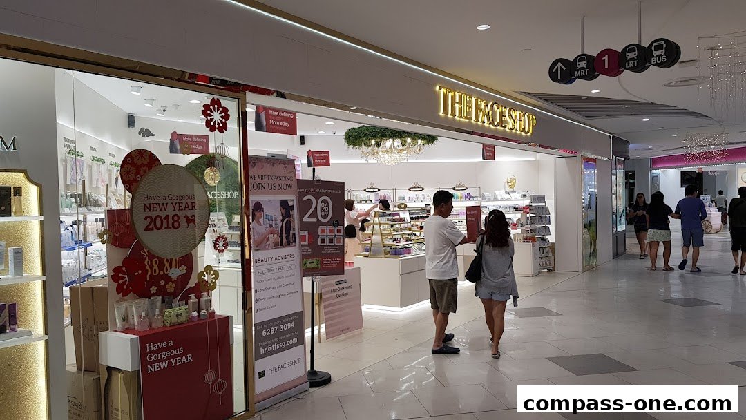 The entrance of The Face Shop, a beauty store, decorated for the New Year with promotional banners.