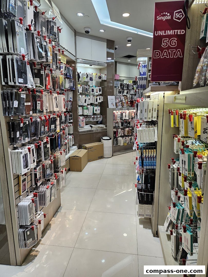 Interior view of a mobile phone accessories shop with shelves stocked with phone cases and accessories.