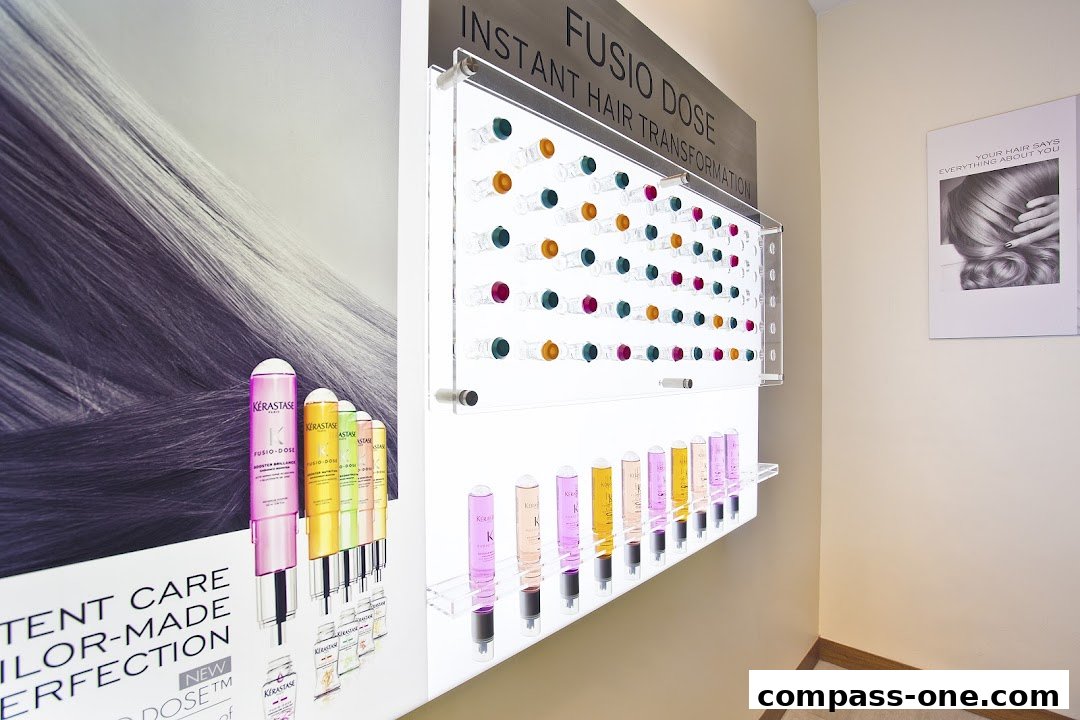 Display of Kérastase Fusio-Dose hair treatments with colorful vials and product bottles.