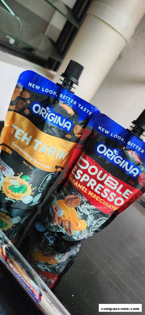 Two pouches of Origina drinks, one Teh Tarik and one Double Espresso Caramel Macchiato.