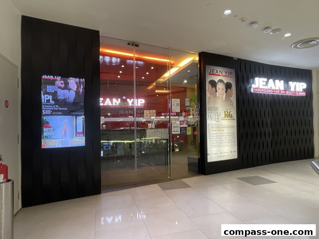 The exterior of the Jean Yip beauty salon, featuring its logo and promotional displays.