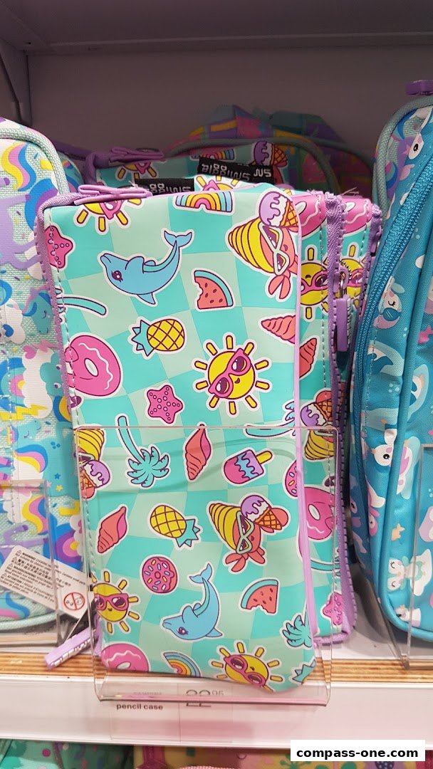 A close-up of a Smiggle pencil case with a fun, summery design featuring dolphins, ice cream, and sunglasses.