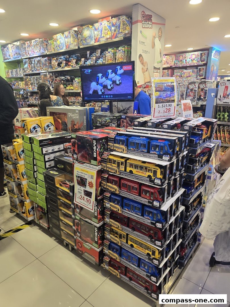 A brightly lit toy store interior showcasing shelves filled with various toys and a display of toy buses.