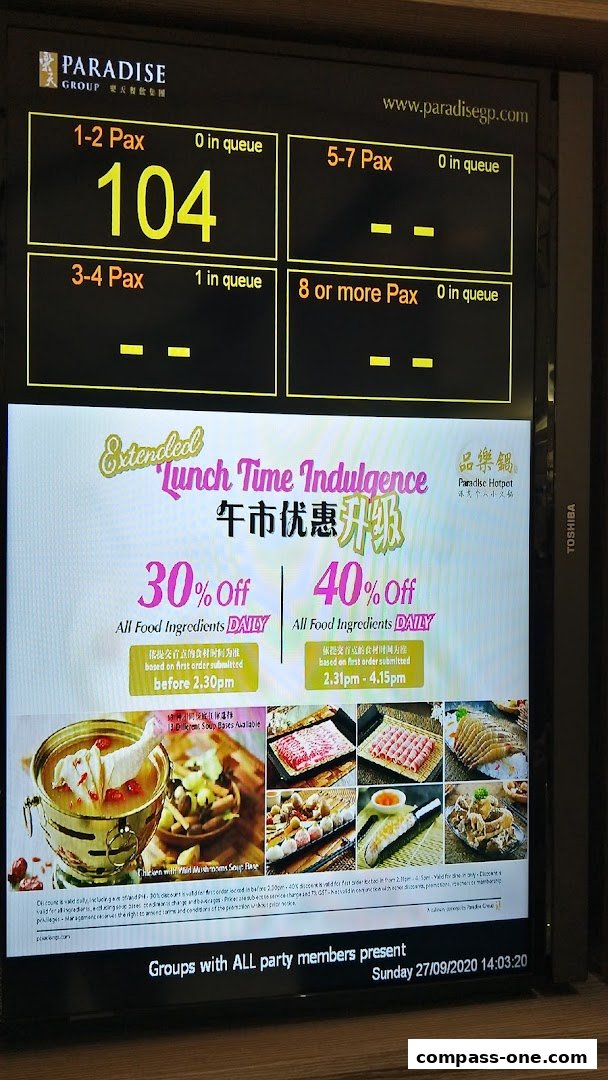 A screen displaying queue numbers and lunch promotions for Paradise Hotpot.