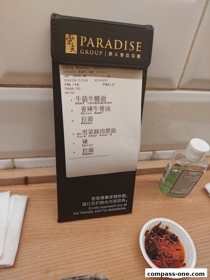 A receipt from LeNu Chefs Wai Noodle Bar showing noodle dishes and soup.