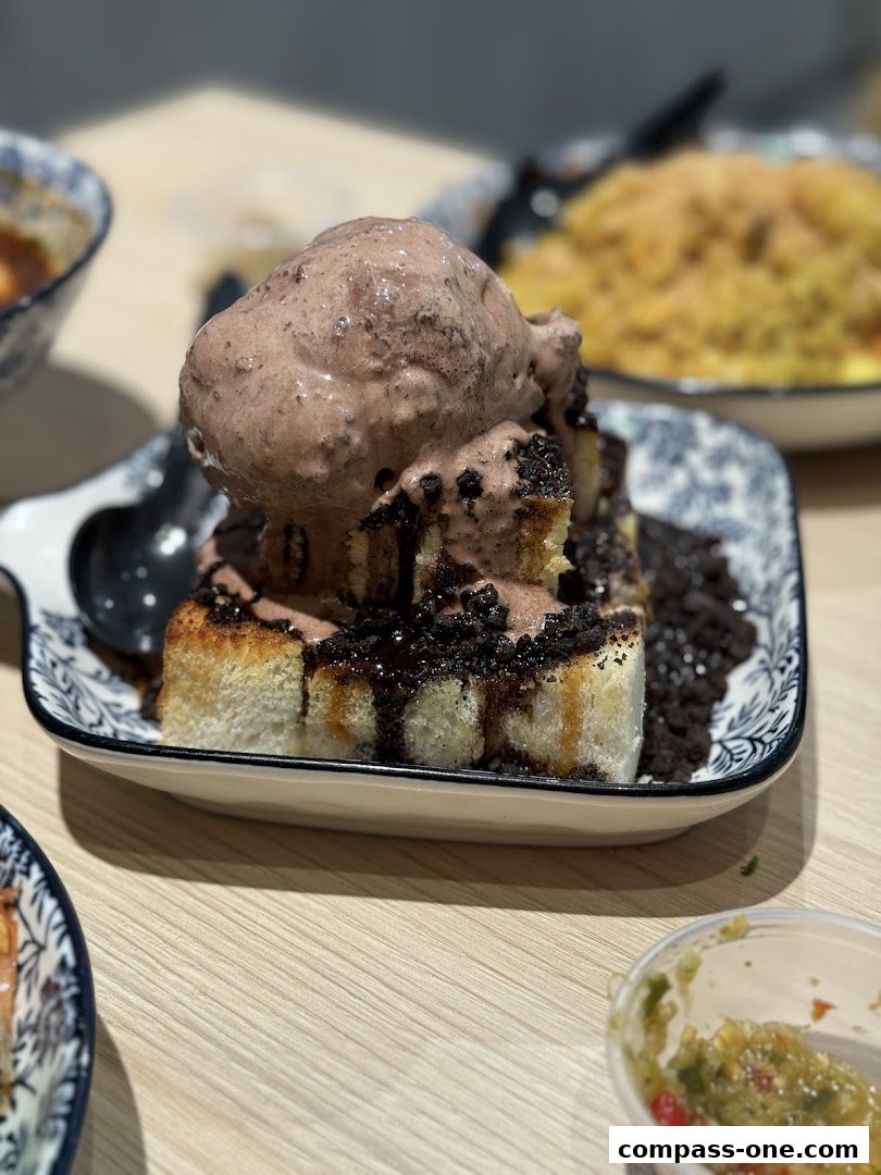 A delicious chocolate ice cream dessert with crushed cookies on toast.