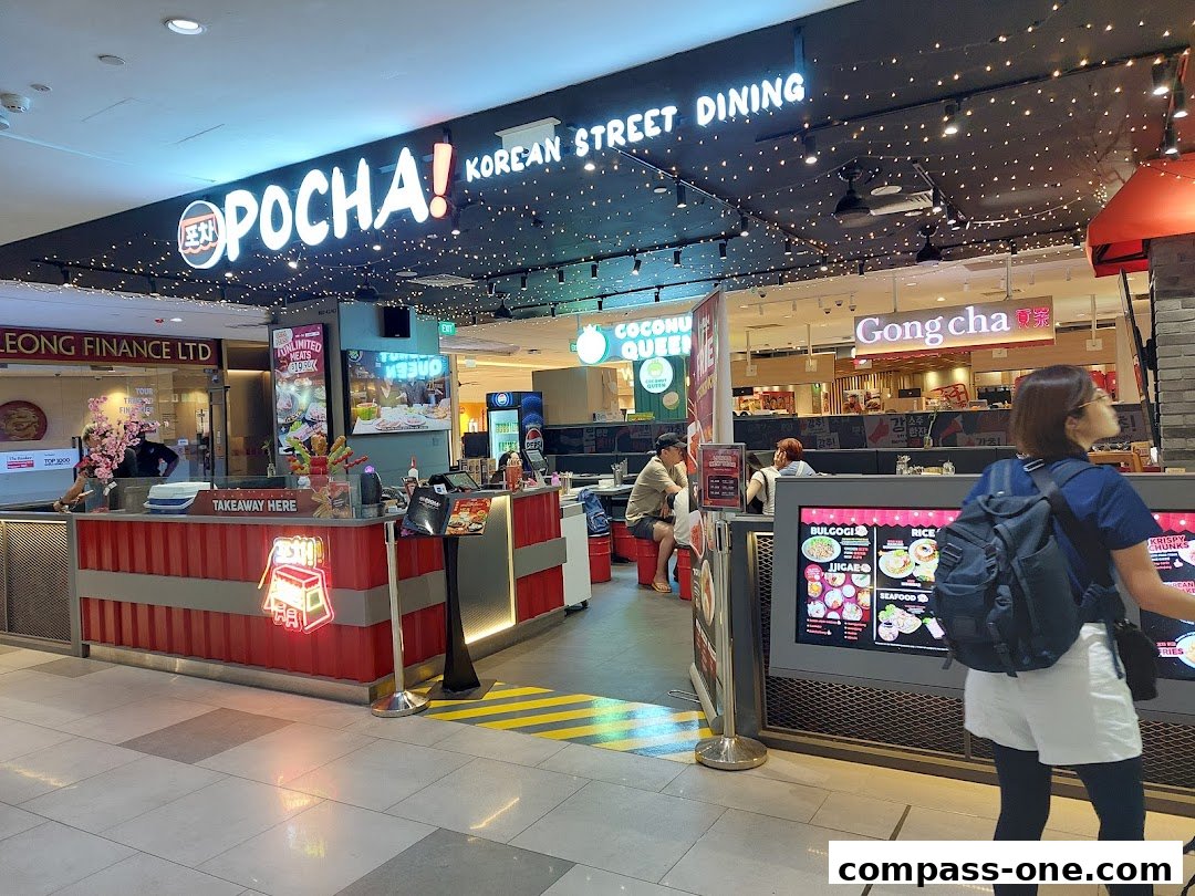The exterior of POCHA! Korean Street Dining with a takeaway counter and seating area.