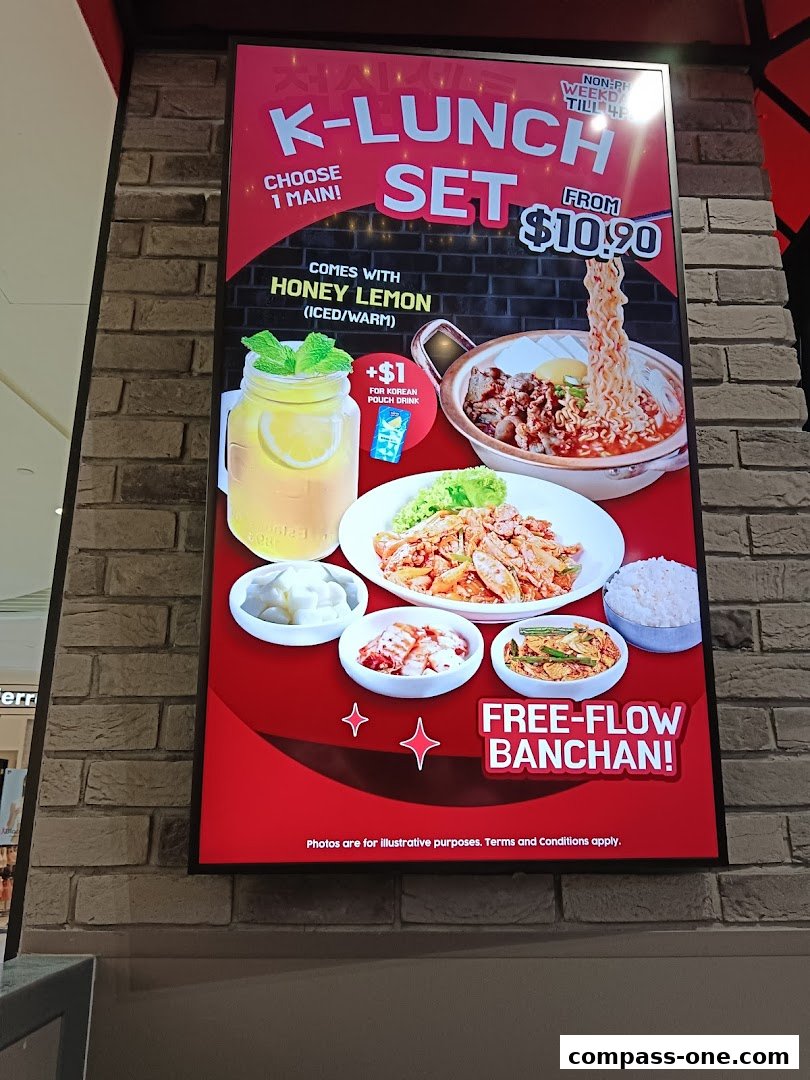 A promotional sign for a Korean K-Lunch Set with free-flow banchan.