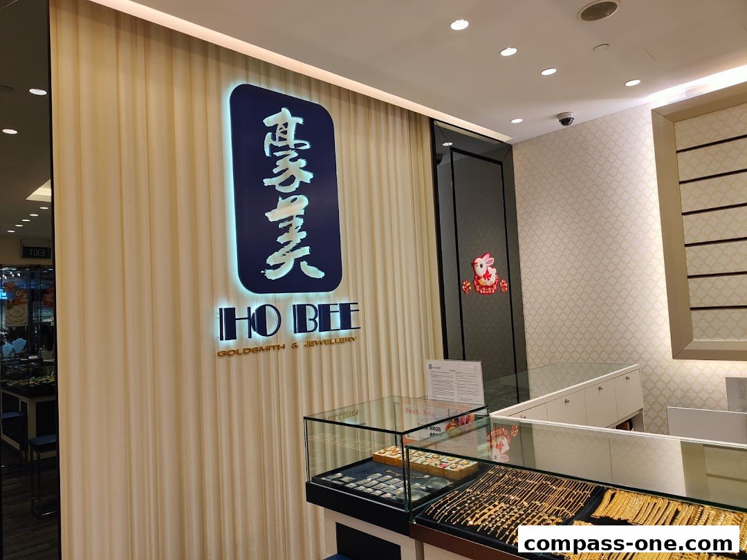 The Ho Bee Goldsmith & Jewellery shop front with illuminated signage and display cases.