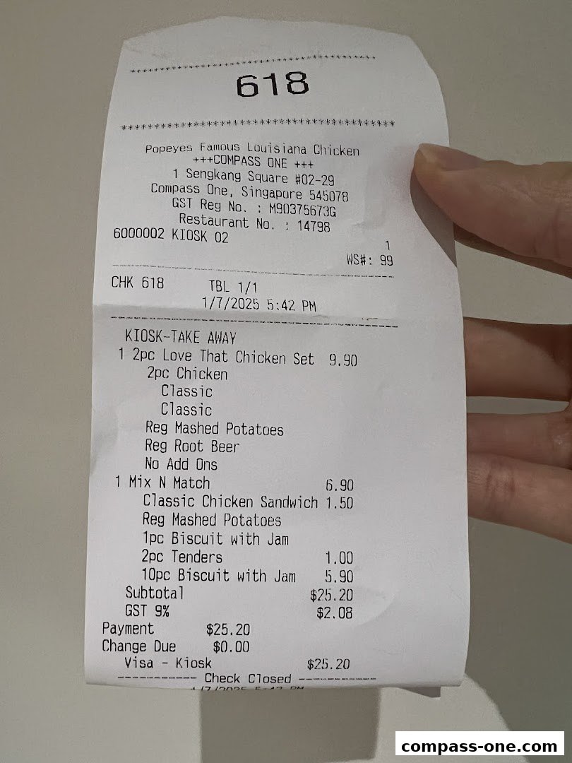 A receipt from Popeyes Famous Louisiana Chicken showing a take-away order with various chicken items and sides.