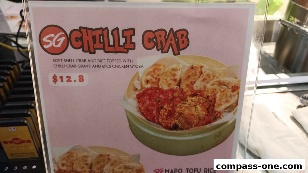 A menu item featuring SG Chilli Crab with soft shell crab, rice, and chicken gyoza.