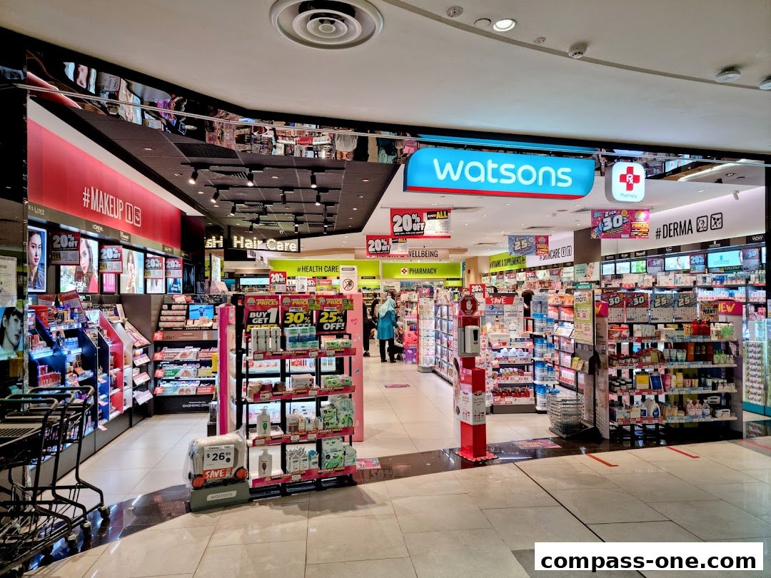 The interior of a Watsons pharmacy and beauty store, showcasing makeup, hair care, and health products.
