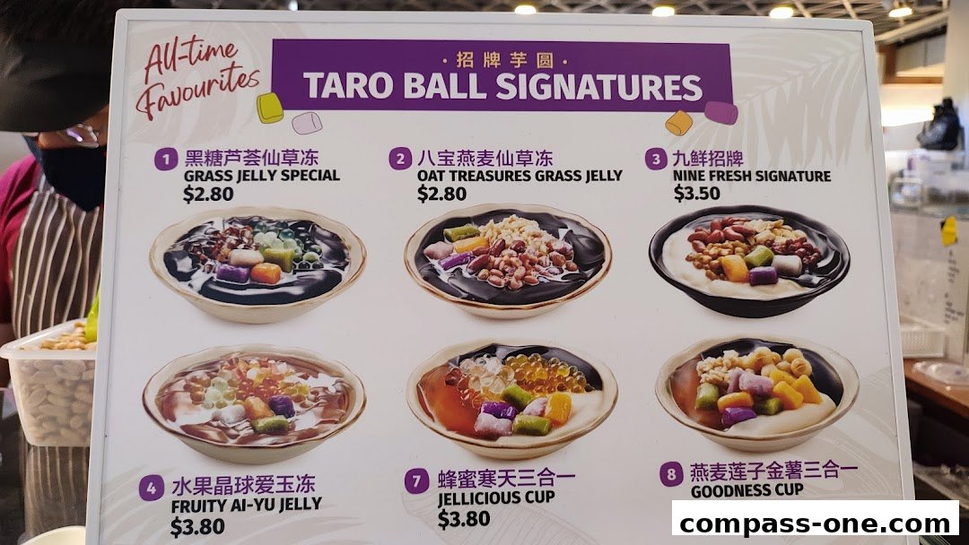 A menu board showcasing various Taro Ball Signature desserts with colorful toppings and prices.