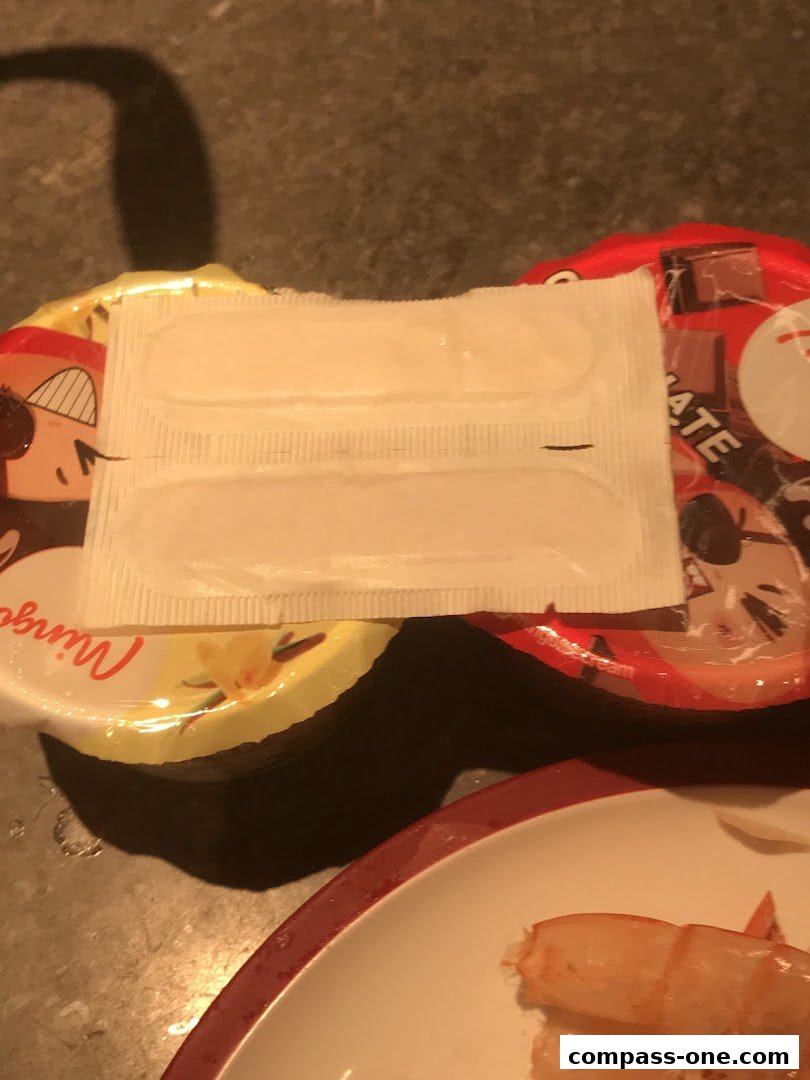 A close-up of packaged food items, possibly desserts, with a focus on a white wrapper.