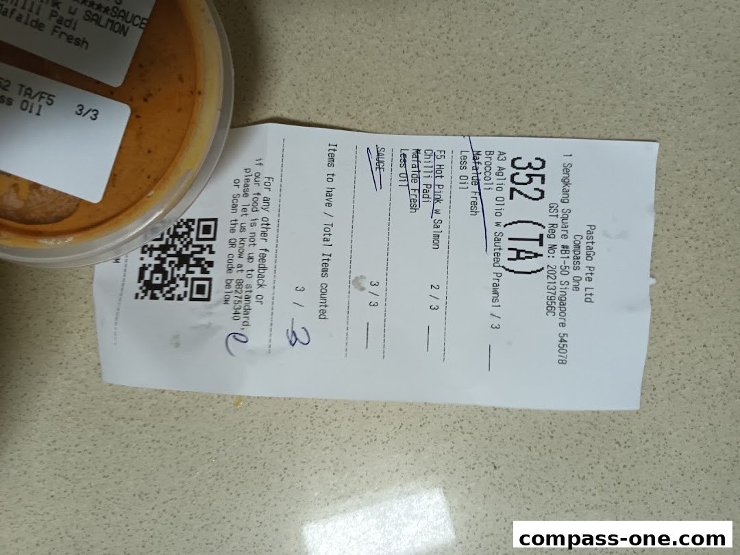 A receipt and a container of pasta sauce from PastaGo at Compass One.