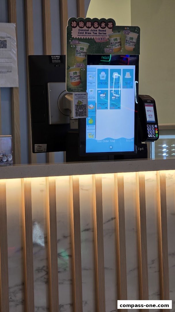 A self-order kiosk and payment terminal at Mr. Coconut Compass One.