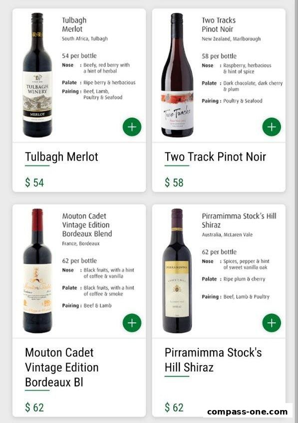 A display of four different wine bottles with their descriptions and prices.