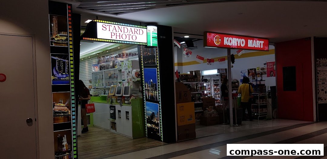 The exterior of Standard Photo shop, showcasing its display and entrance.